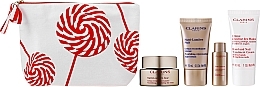 Set - Clarins Nutri-Lumiere Christmas Set (f/cr/50ml + f/cr/15ml + f/lot/10ml + h/cr/30ml + bag) — photo N2