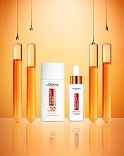 Brightening Day Cream SPF 50+ - L'Oreal Paris Revitalift Clinical — photo N7