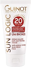 Fragrances, Perfumes, Cosmetics Anti-Aging Bronzing Sun Face Cream - Guinot Sun Logic Uni Bronze Anti-Ageing Tinted SPF20