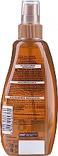 Soothing Tan Oil Spray - DAX Sun Body Oil SPF 6 — photo N2